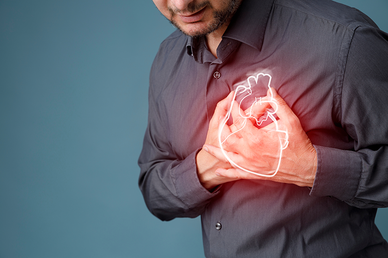 A middle-aged man clutched his chest while experiencing a fluttering sensation from a condition known as atrial fibrillation or AFib.