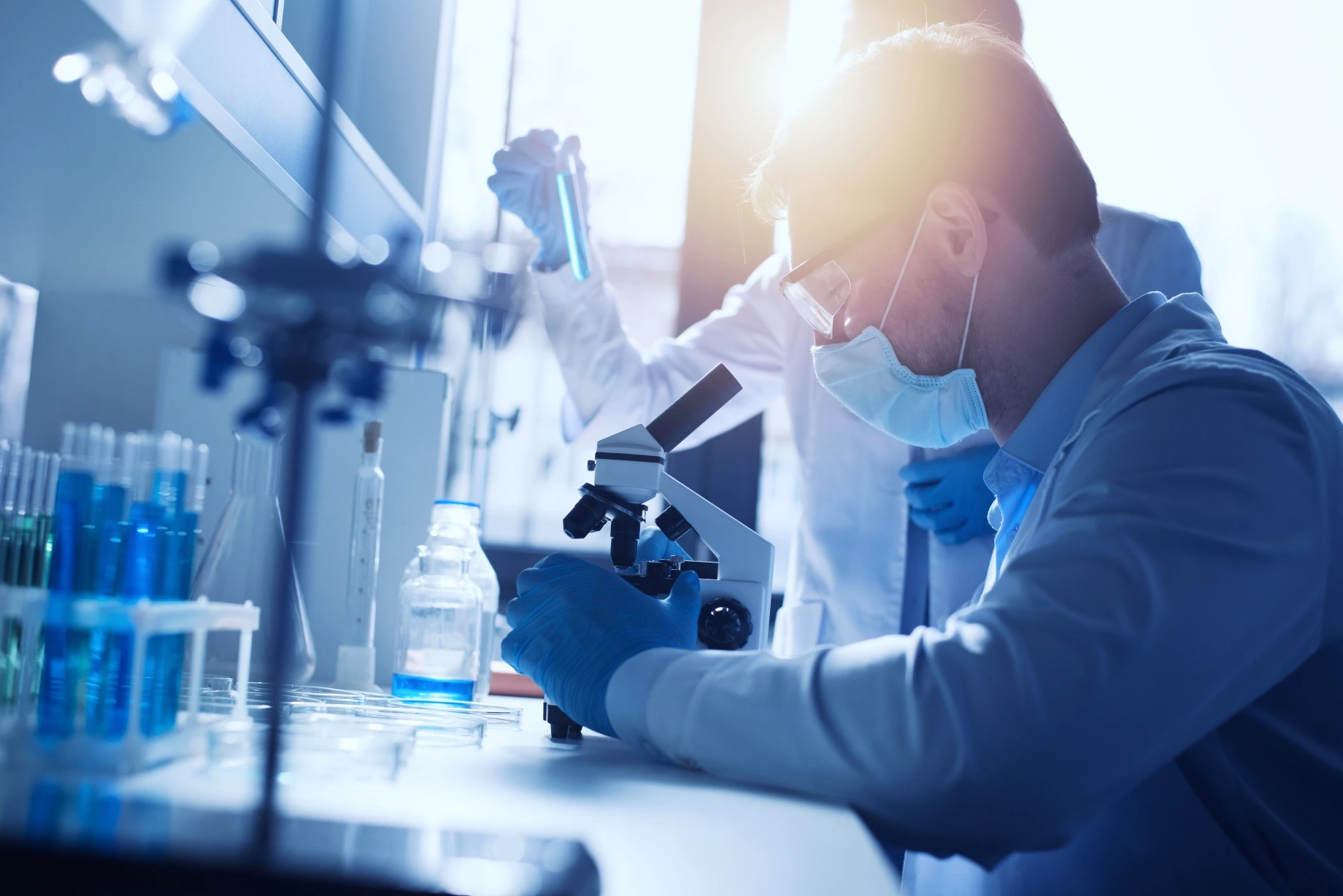 Researcher examining samples in a clinical laboratory